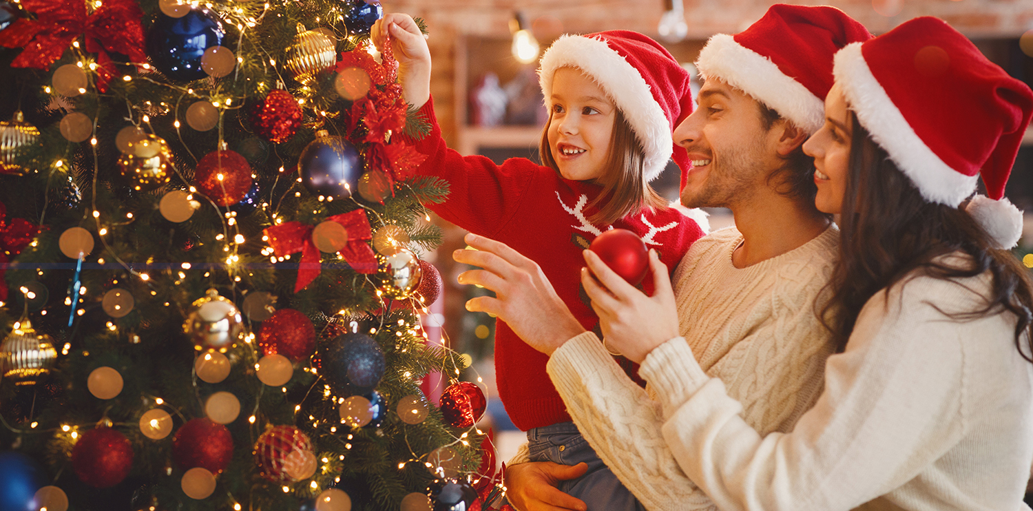 Festive shopping tips with a budget checklist and gift items on a table.
